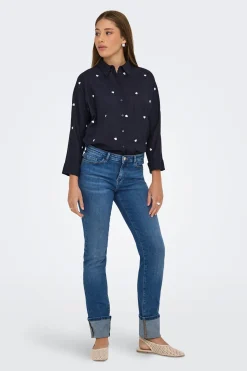 Jeans slim bajo vuelto