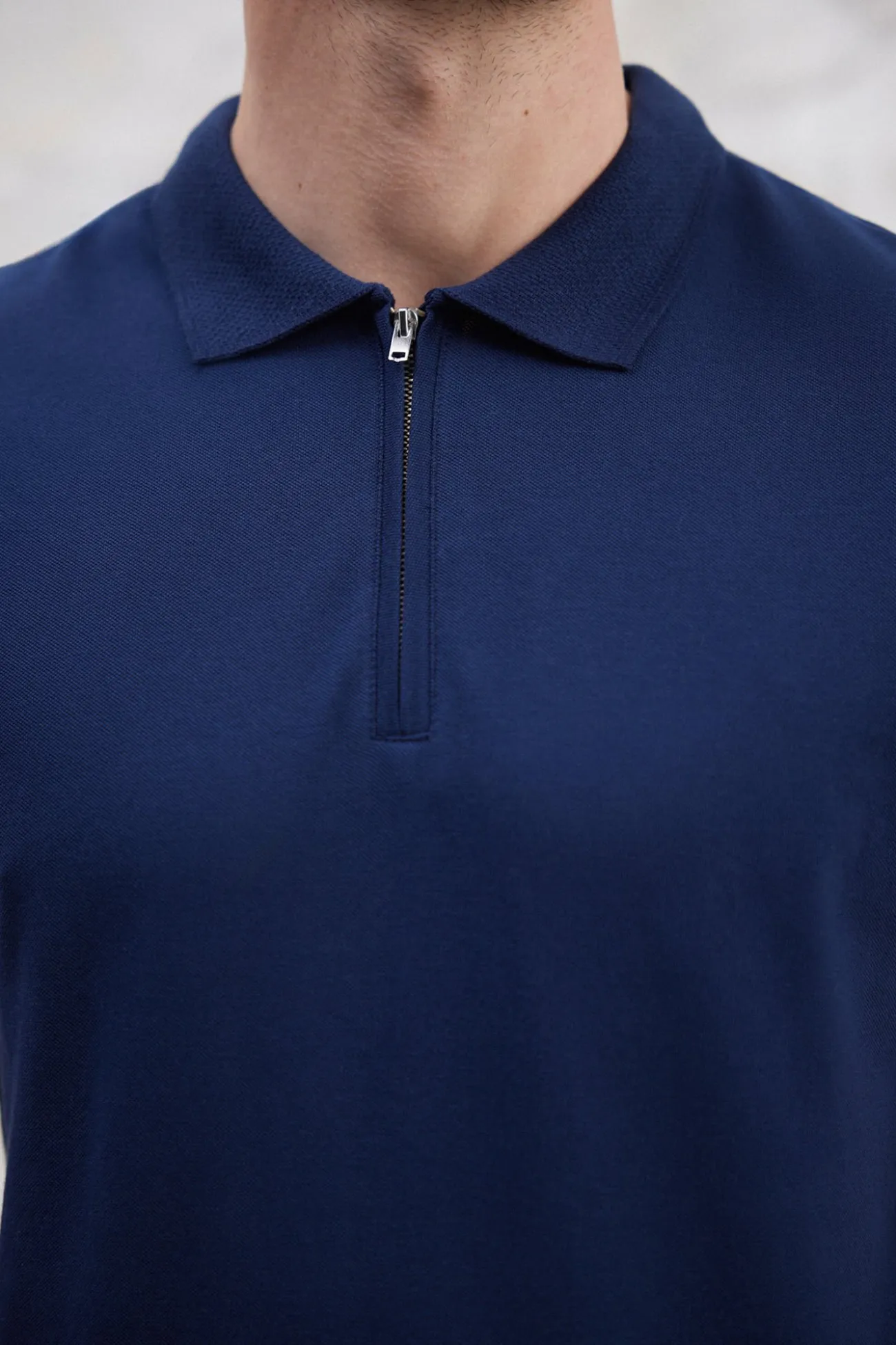 Polo de manga corta y cremallera